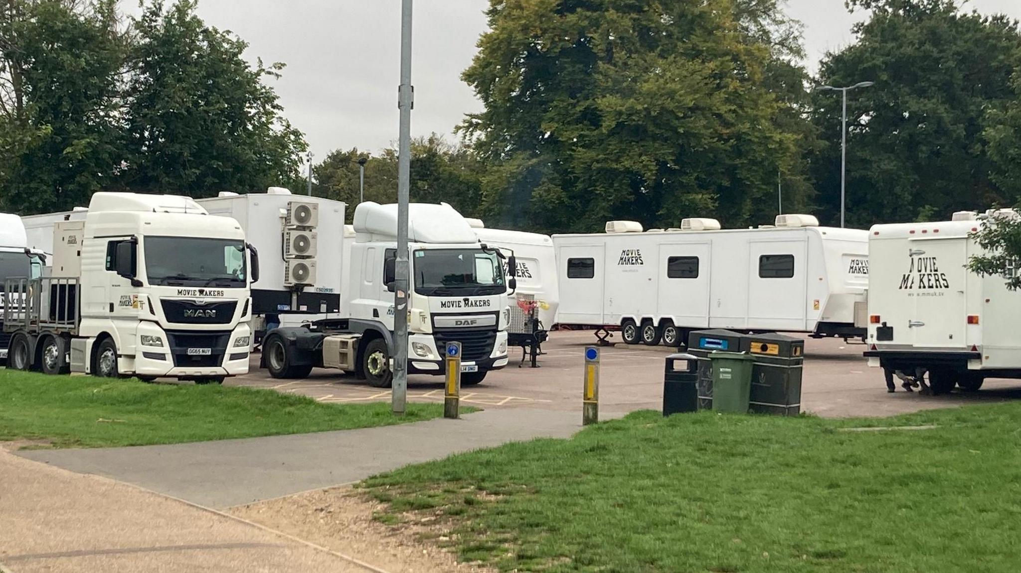 A number of white lorries with Movie Makers written on them in a car park at Westminster Lodge, St Albans.