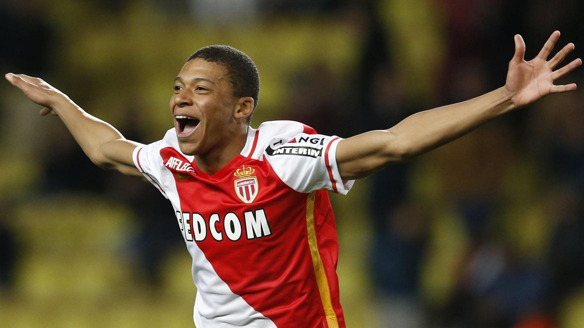 Kylian Mbappe celebrates scoring a goal for Monaco