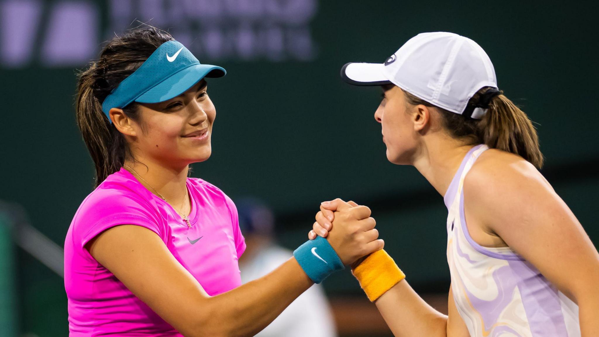 Emma Raducanu shakes hands with Iga Swiatek aft  their 2023 Indian Wells match