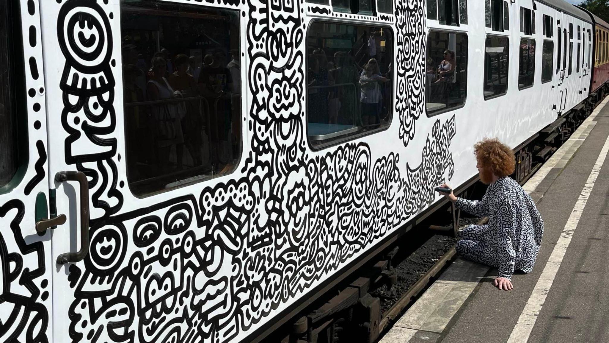 mr doodle painting a train