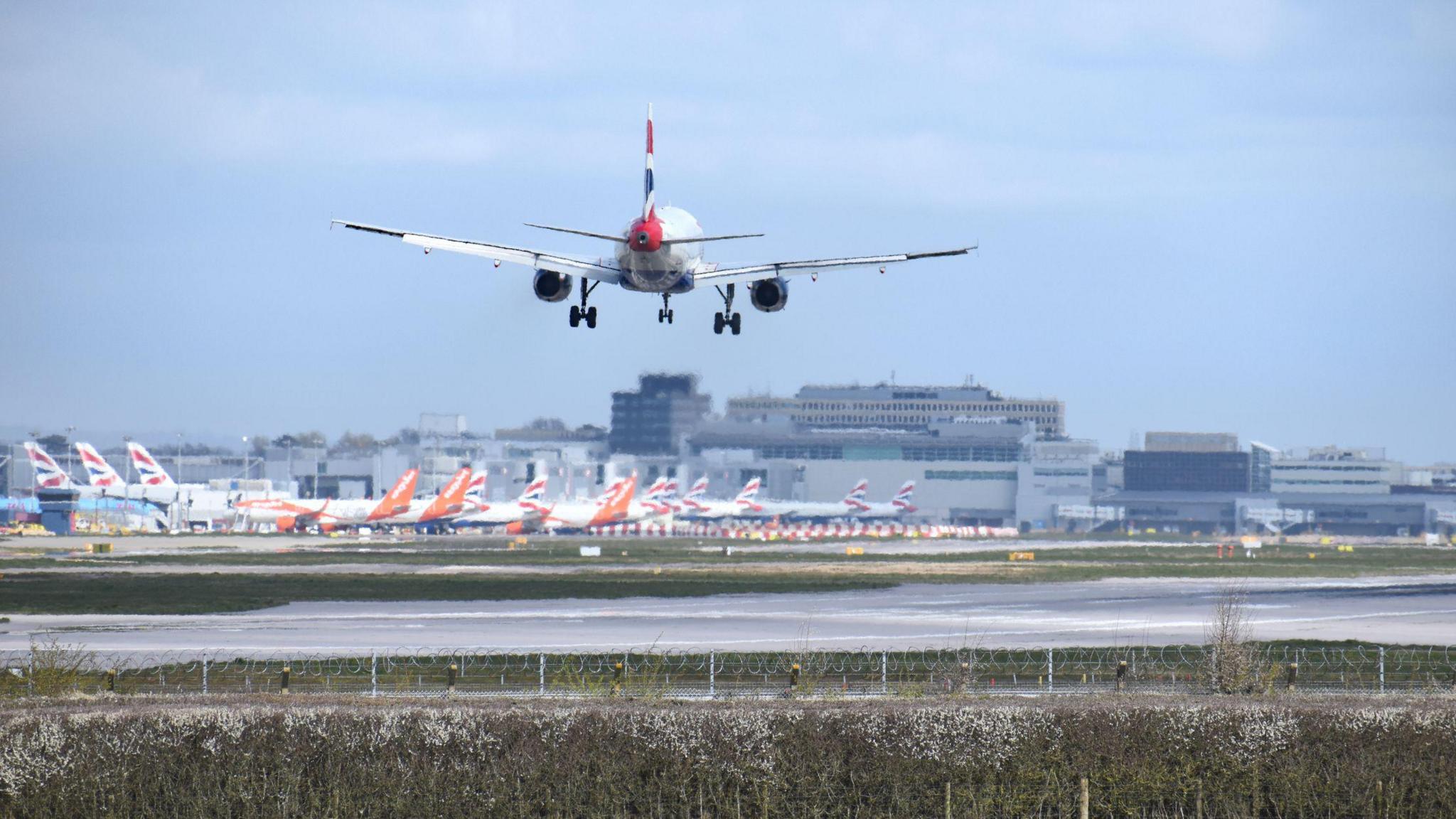 A plane lands on a runway.