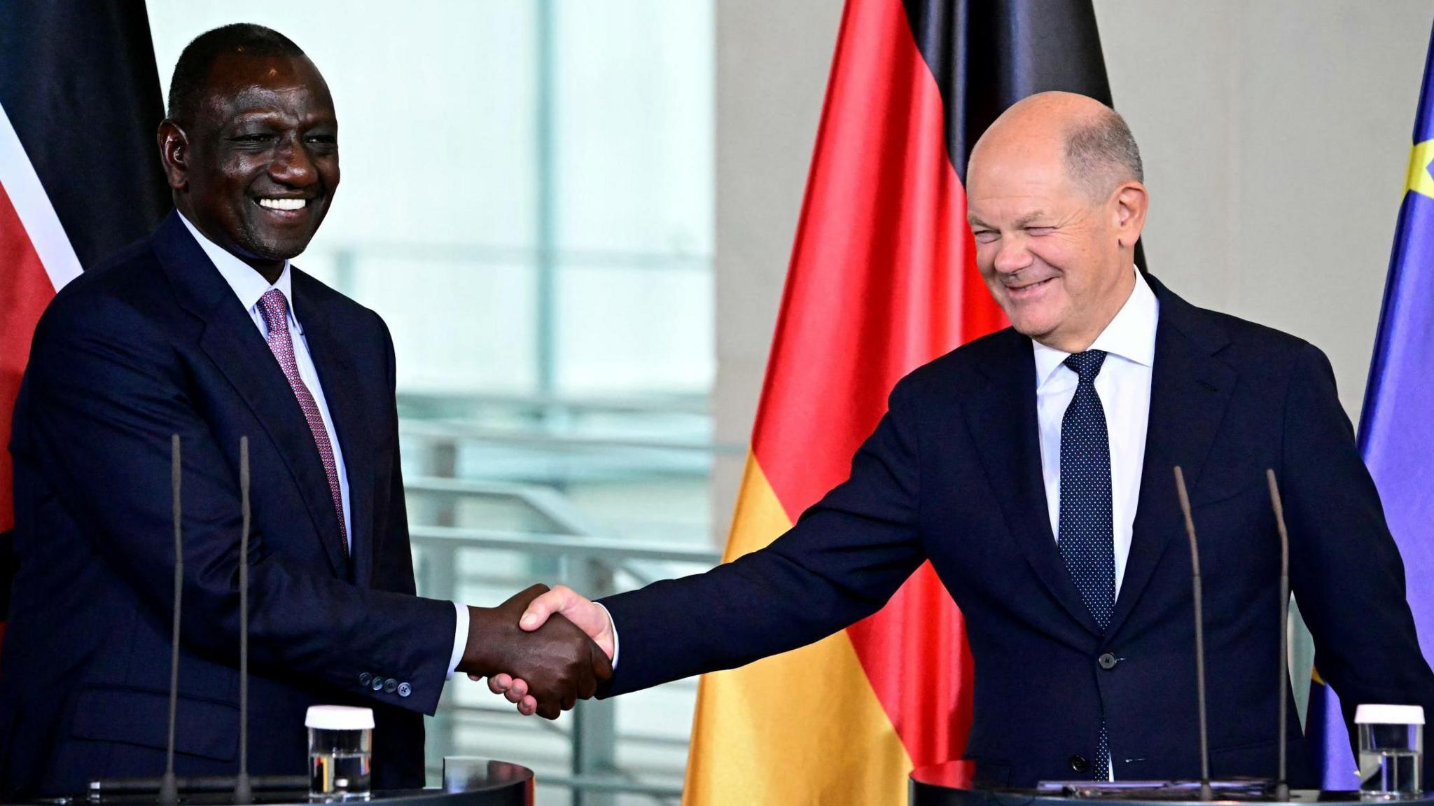 German Chancellor Olaf Scholz (R) and Kenya's President William Ruto shake hands at the end of a joint press conference on September 13, 2024 at the Chancellery in Berlin.