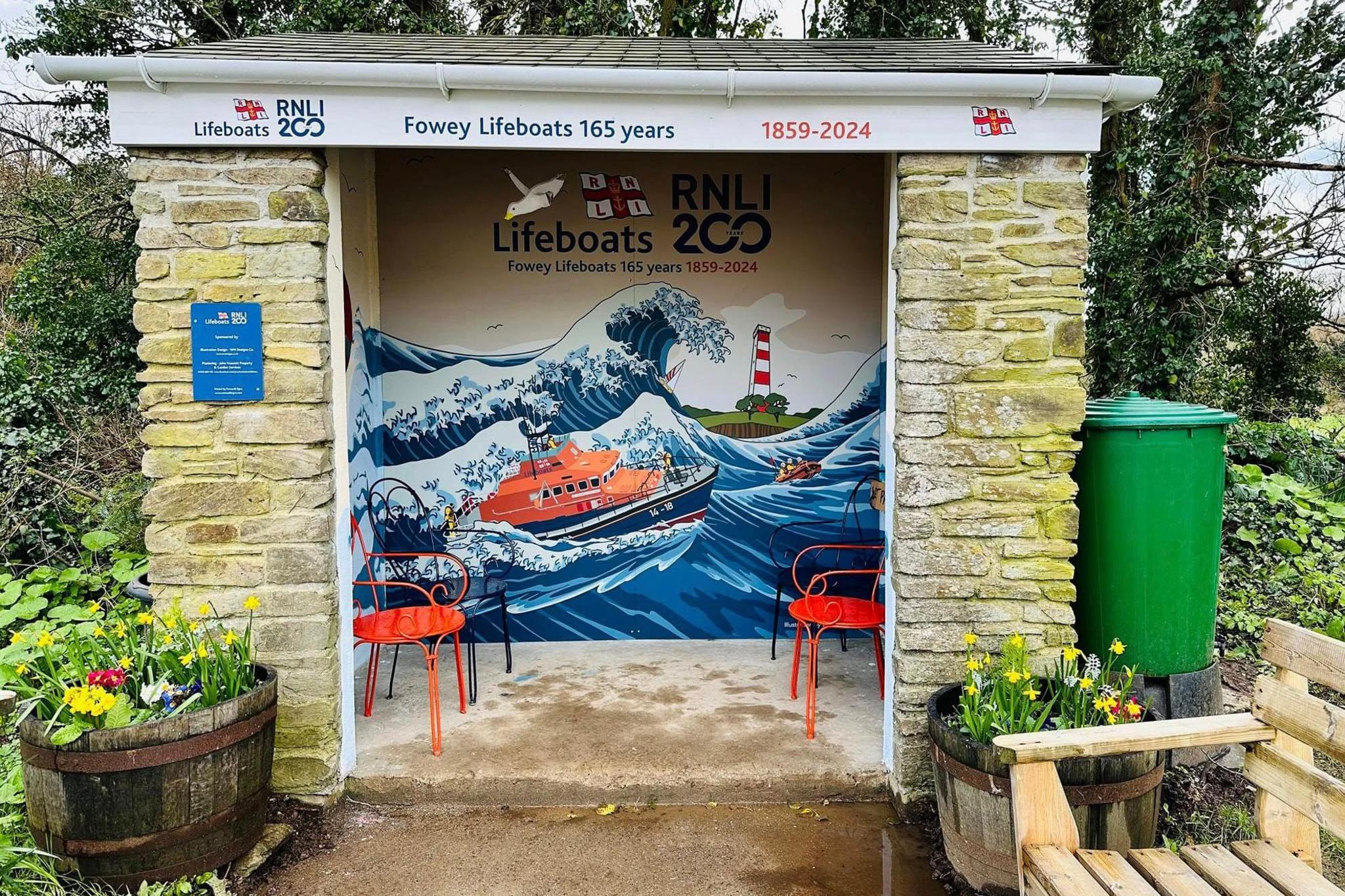 bus stop with lifeboat painted inside 