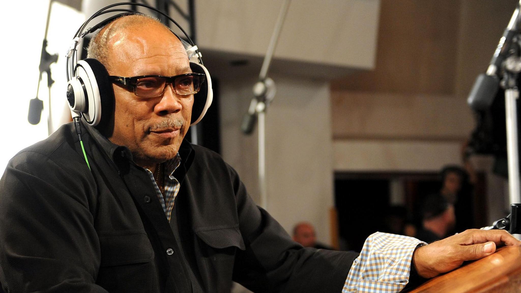 Quincy Jones in the studio with his headphones on