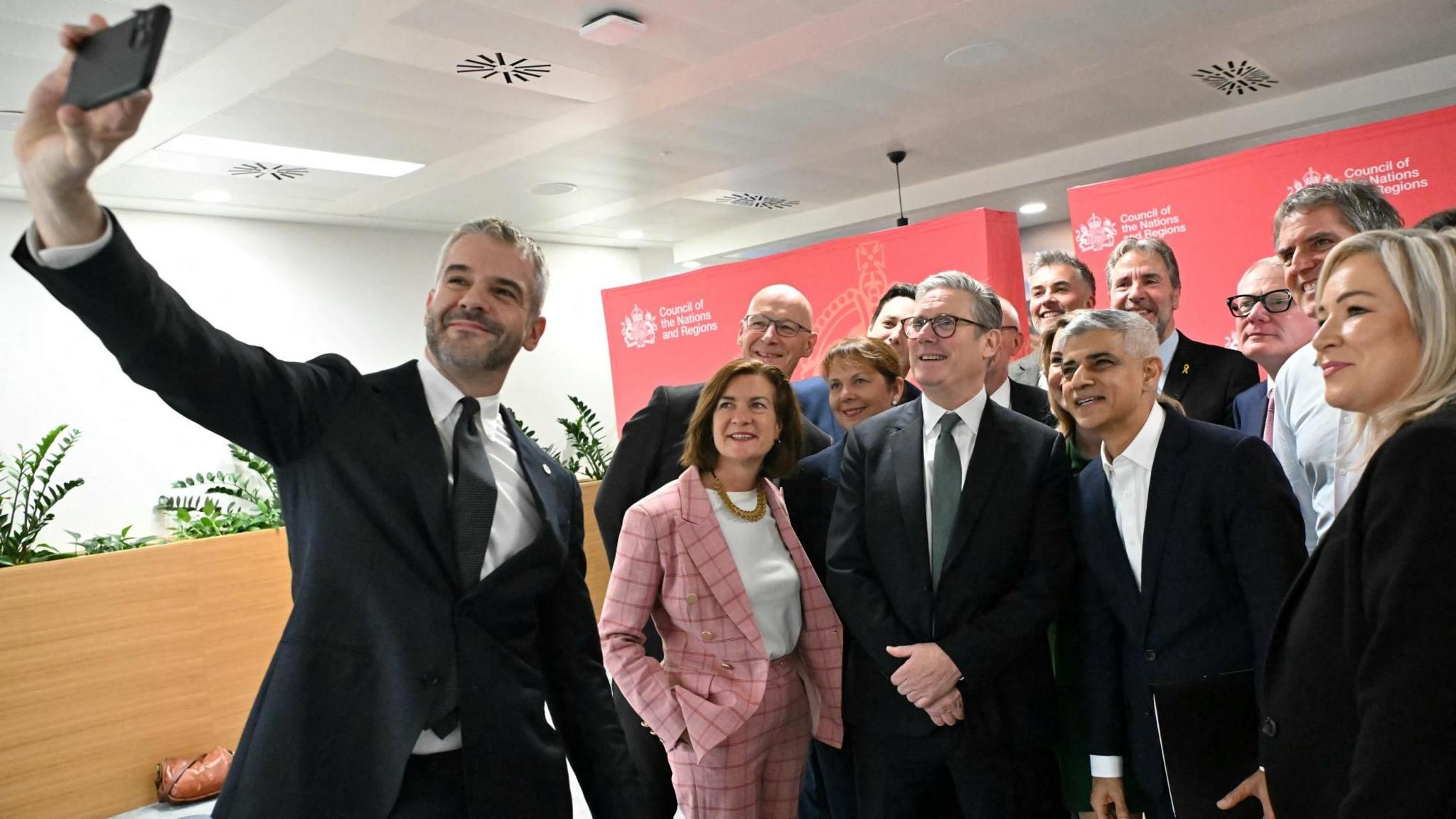 South Yorkshire Mayor Oliver Coppard takes a selfie with Sir Keir Starmer, Wales' First Minister Eluned Morgan, Scotland's First Minister John Swinney, Northern Ireland's First Minister Michelle O'Neill and other regional mayors