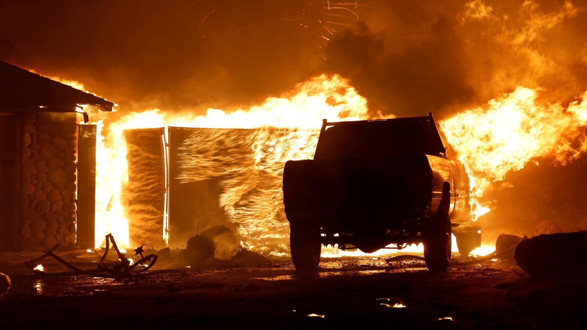 The Park fire engulfs a building and vehicle near Chico