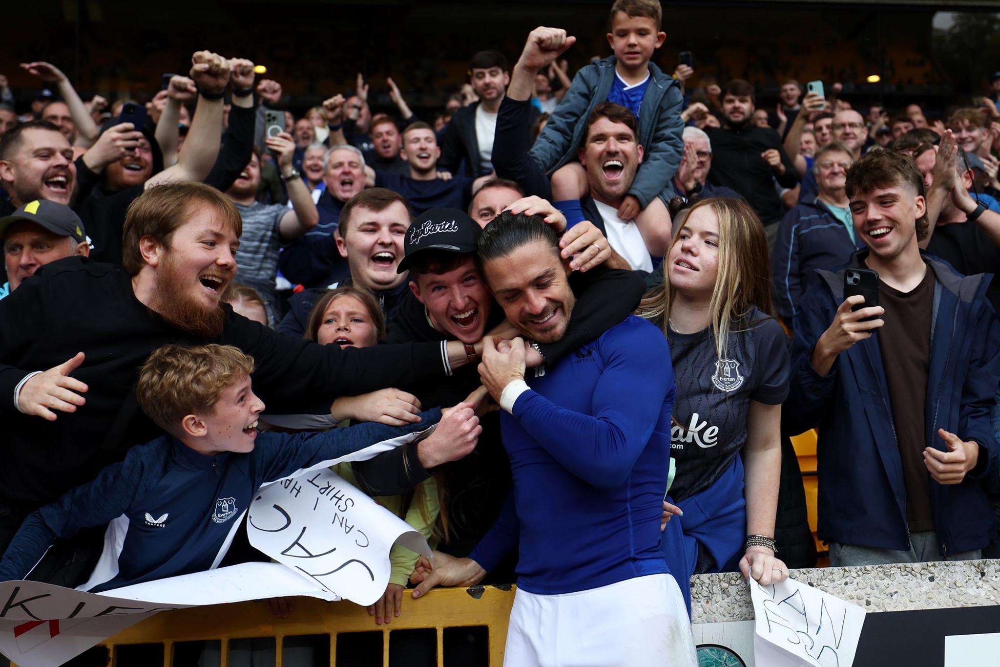 Everton's Jack Grealish celebrates with fans after the team's victory during the Premier League match versus Wolves at Molineux. Photo by Dan Istitene