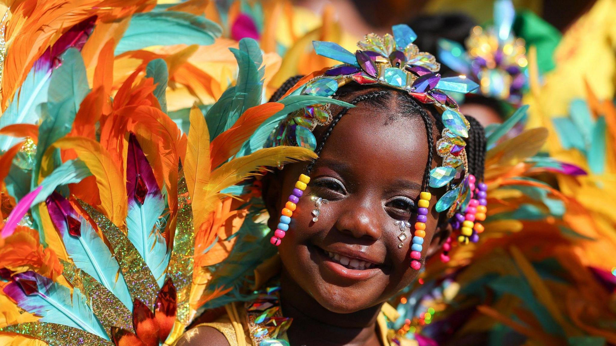A girl wearing a colourful costume.