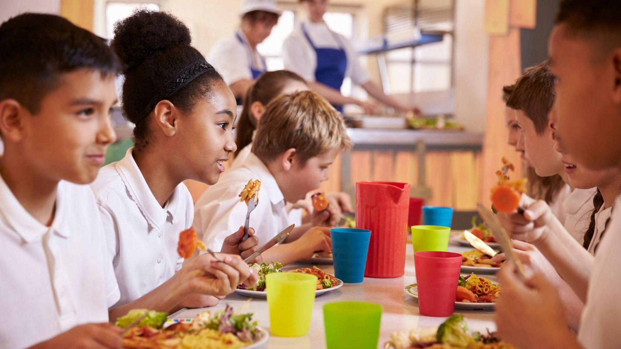 Children eating a school meal.