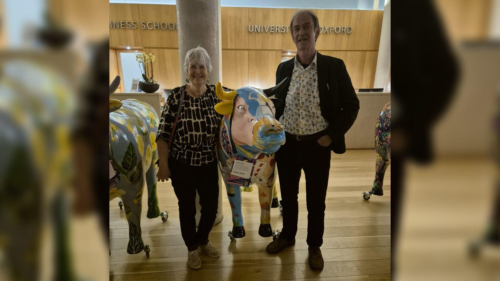 Mark Davies and looking for Alice ox sculpture alongside the artist Caroline Ritson