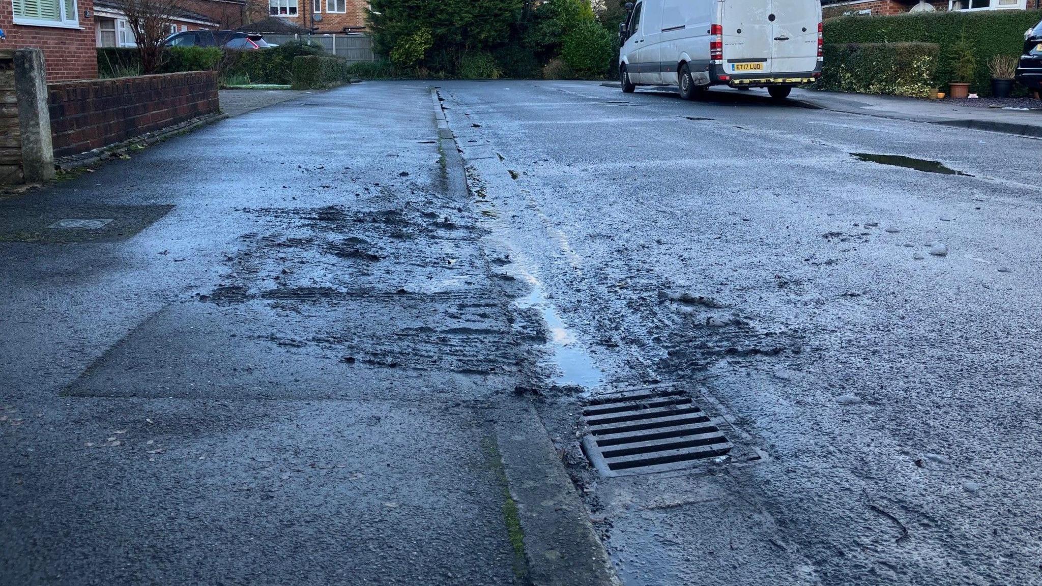 A photograph of a drain which overflowed on Glandon Drive in Cheadle Hulme.