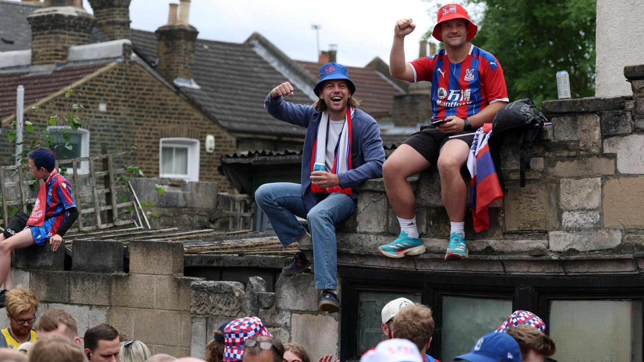 Fans sitting on a roof of a house