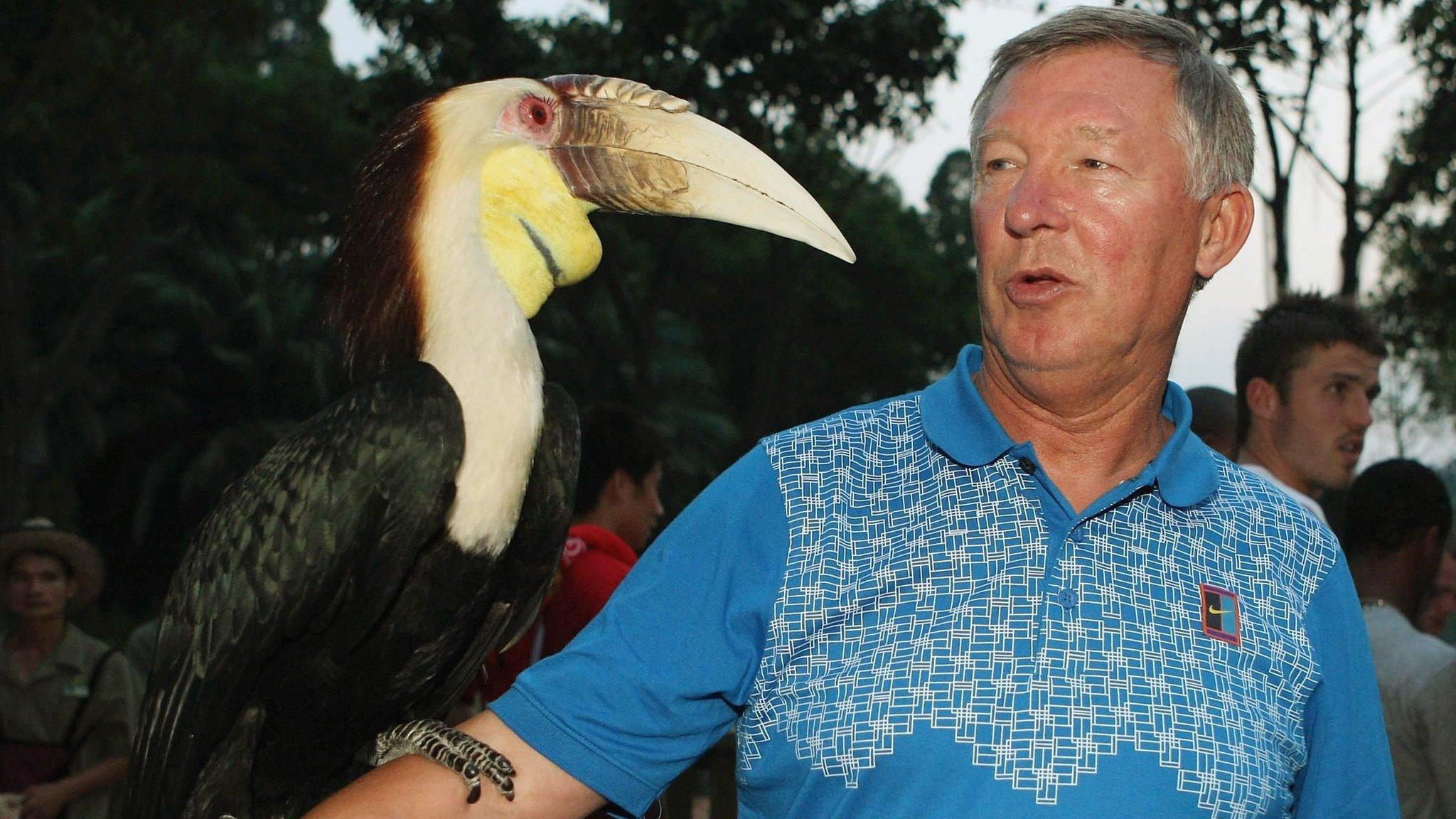 Alex Ferguson holding a toucan