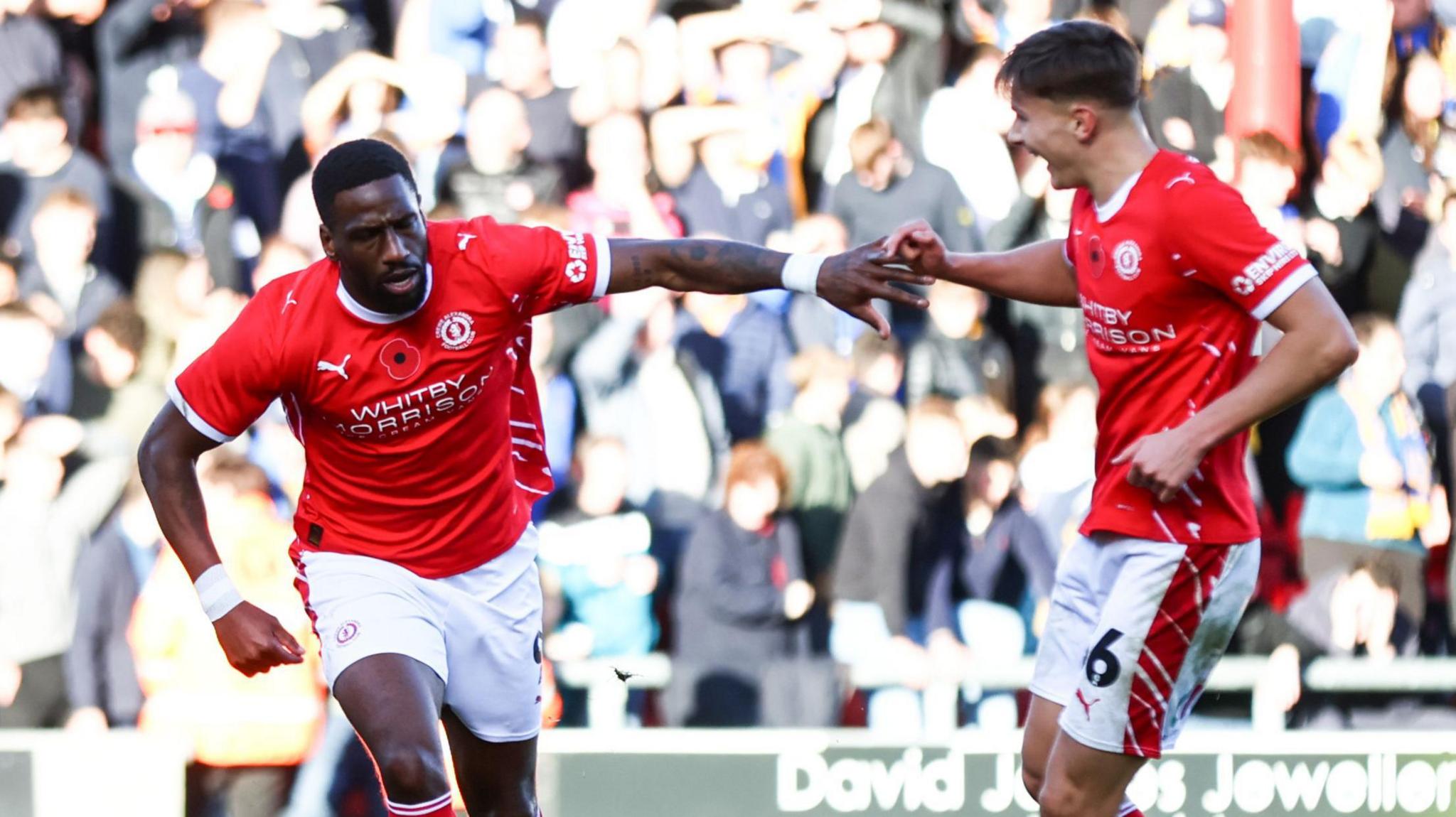 Omar Bogle runs away after scoring Crewe's third goal against Shrewsbury