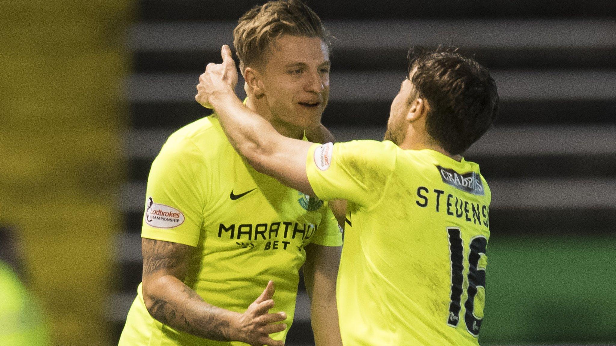 Jason Cummings (left) celebrates for Hibs