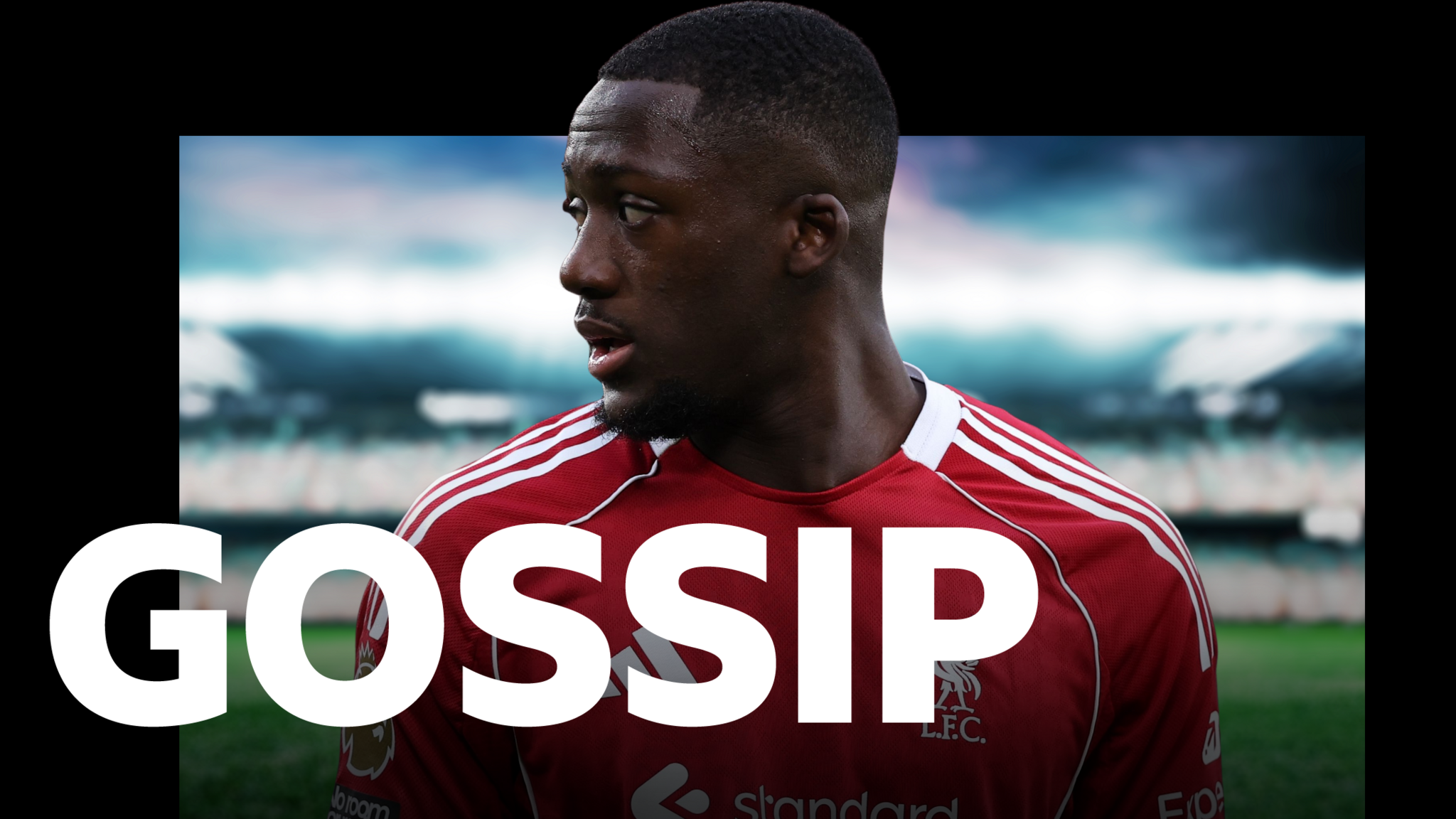 Head-and-shoulders image of Ibrahima Konate. He has short black hair and a goatee beard. He is wearing Liverpool's red home shirt. The word "Gossip" is imposed over the photograph.