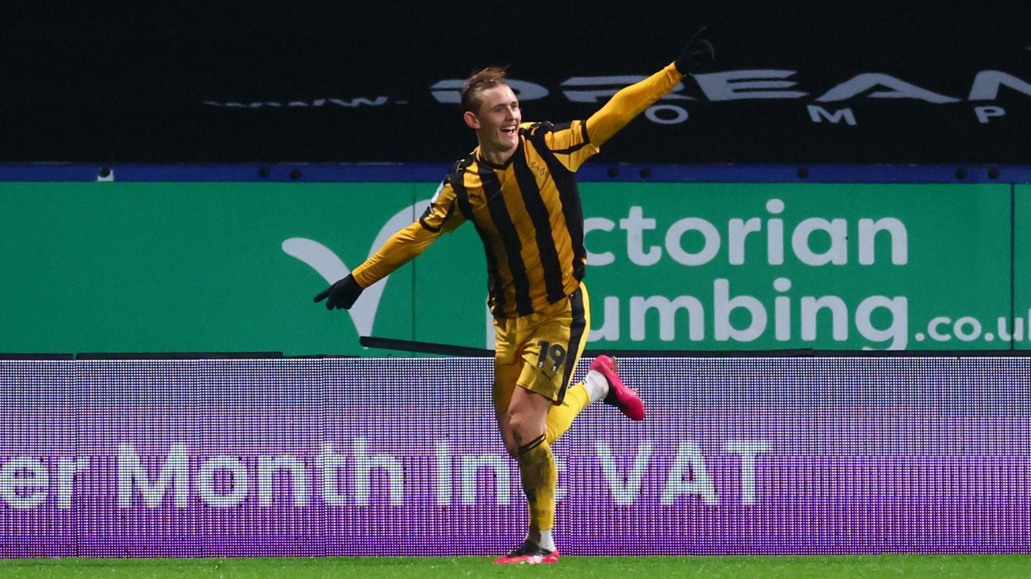 Ben Waine, with his arms outstretched, celebrates his winning goal for Port Vale against Bolton Wanderers.