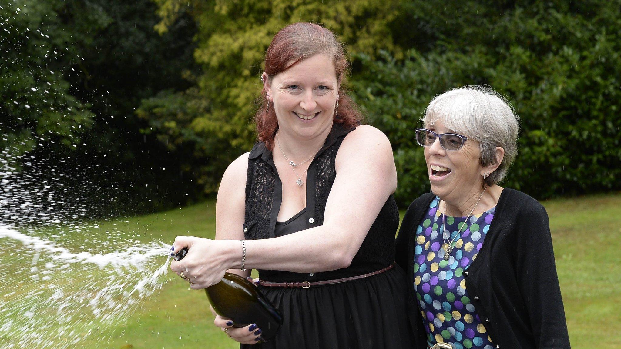 Lottery winners spray champagne