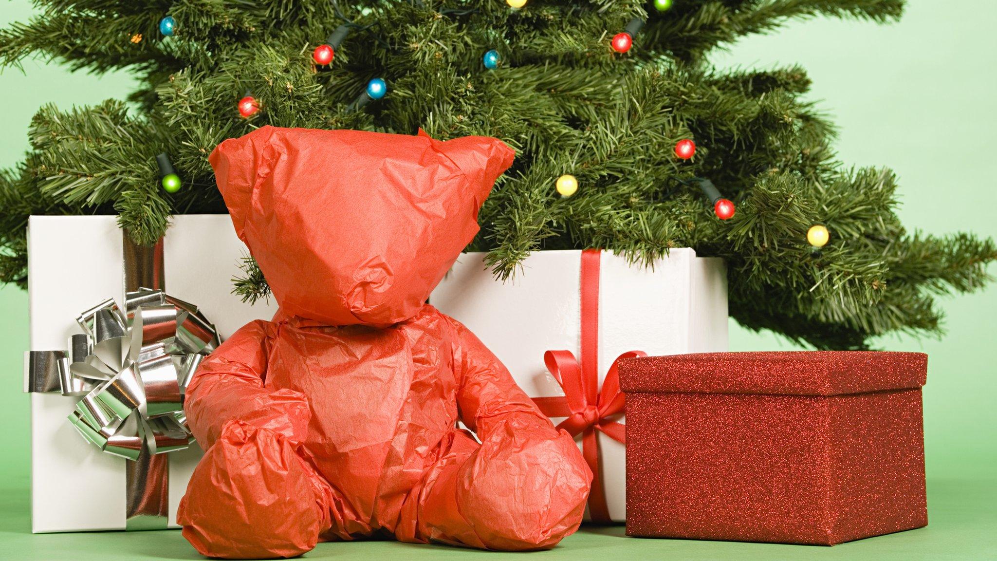 wrapped-up-teddy-bear-under-christmas-tree.