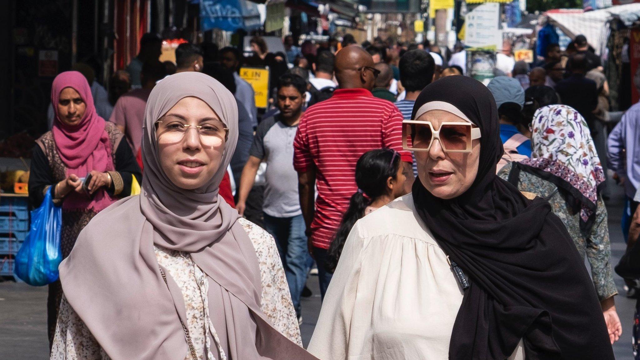 Women walking down Whitechapel High Street