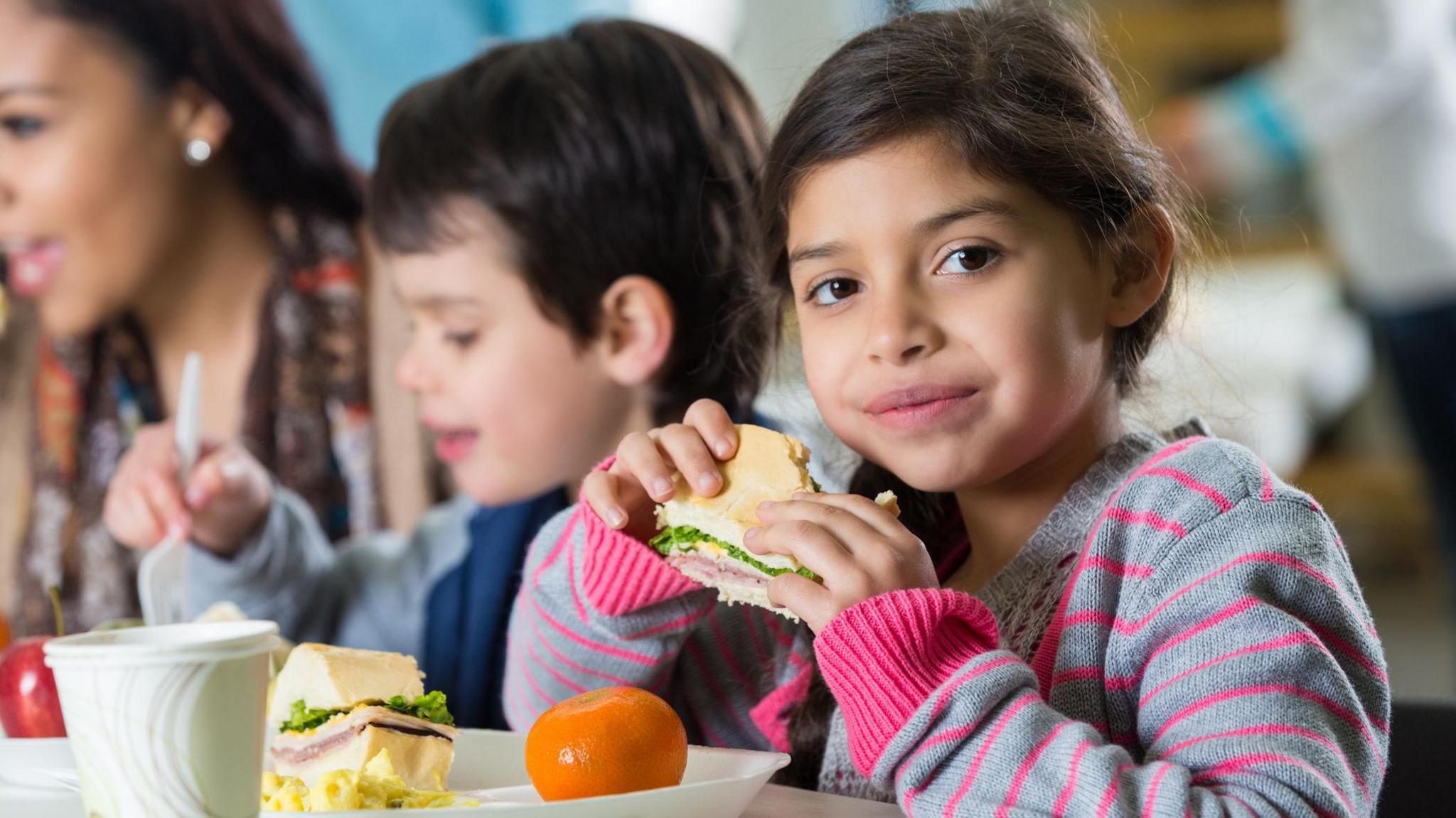 child eating lunch