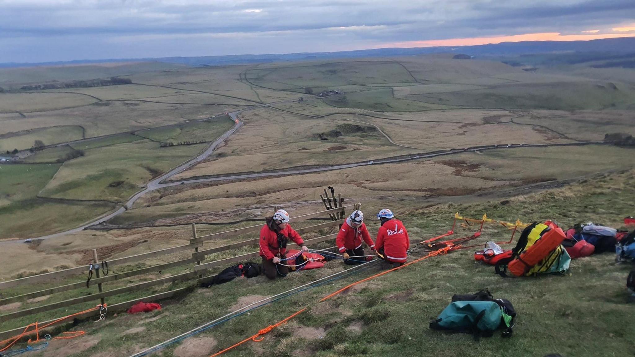 Mountain rescue teams using their rope rescue kit on Mam Tor