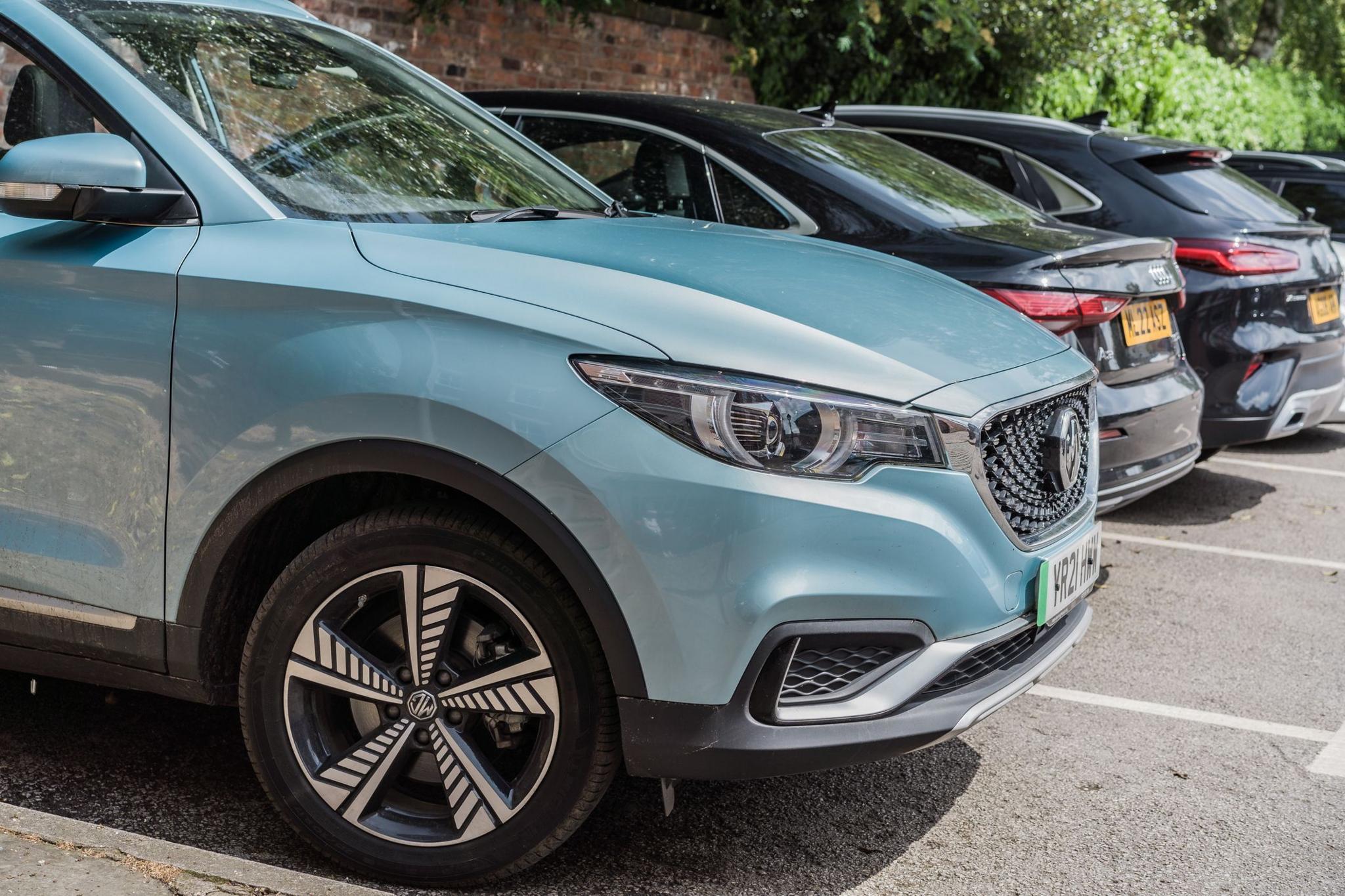 Light blue SUV parked