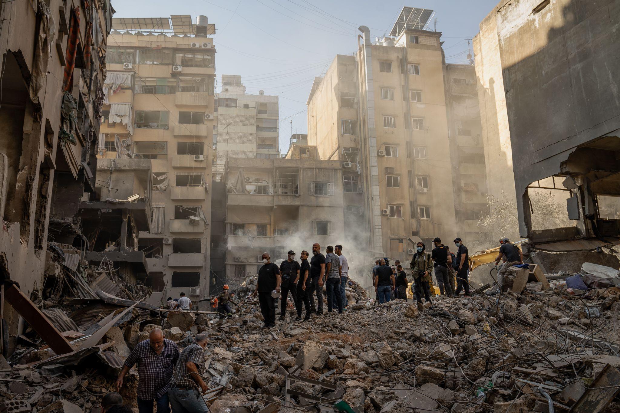 The smoking crater left behind the morning after the apartment building in Basta was destroyed, killing Rihab's family. (Joel Gunter/BBC)