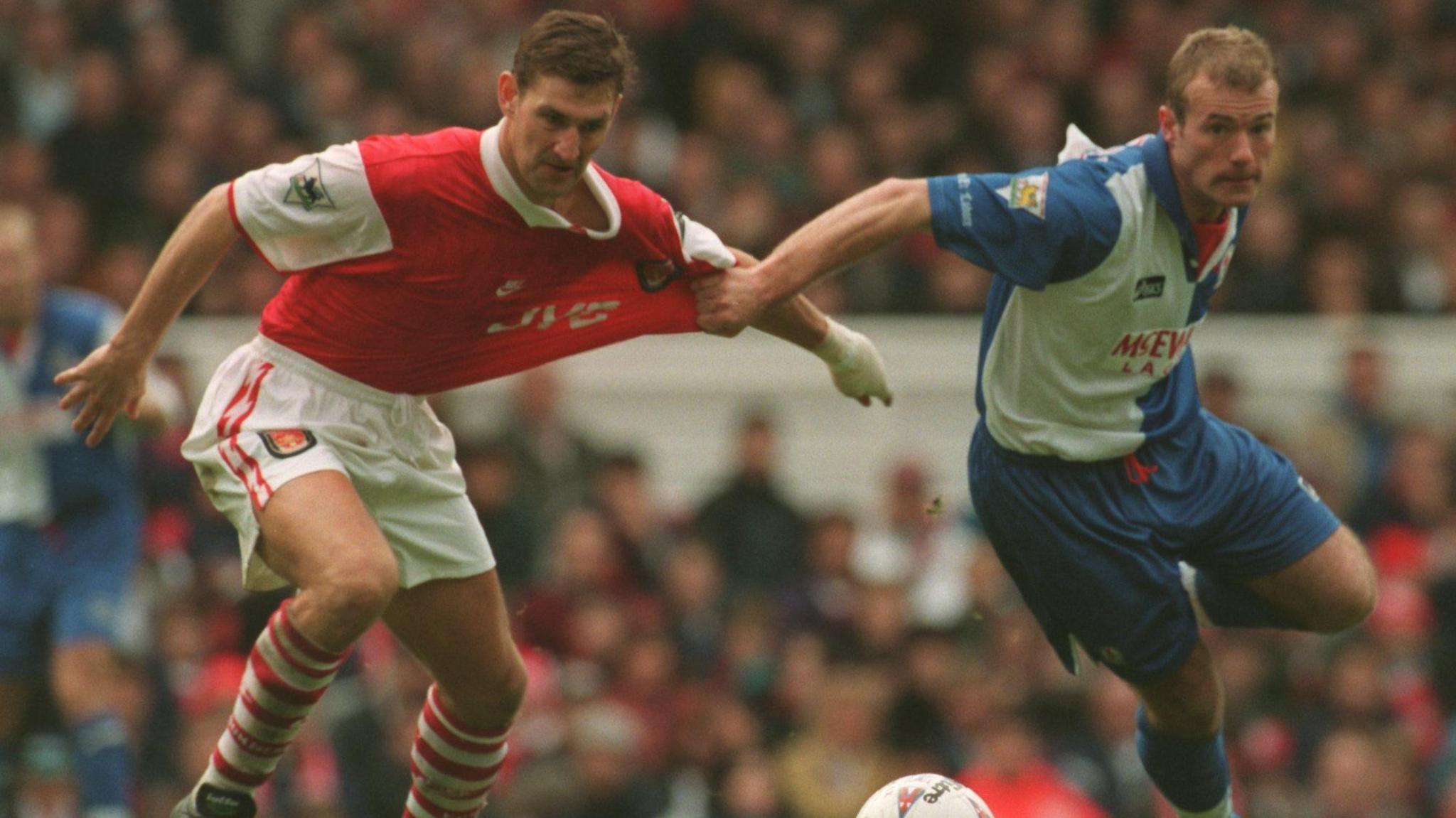 Tony Adams of Arsenal and Alan Shearer of Blackburn Rovers compete for the ball