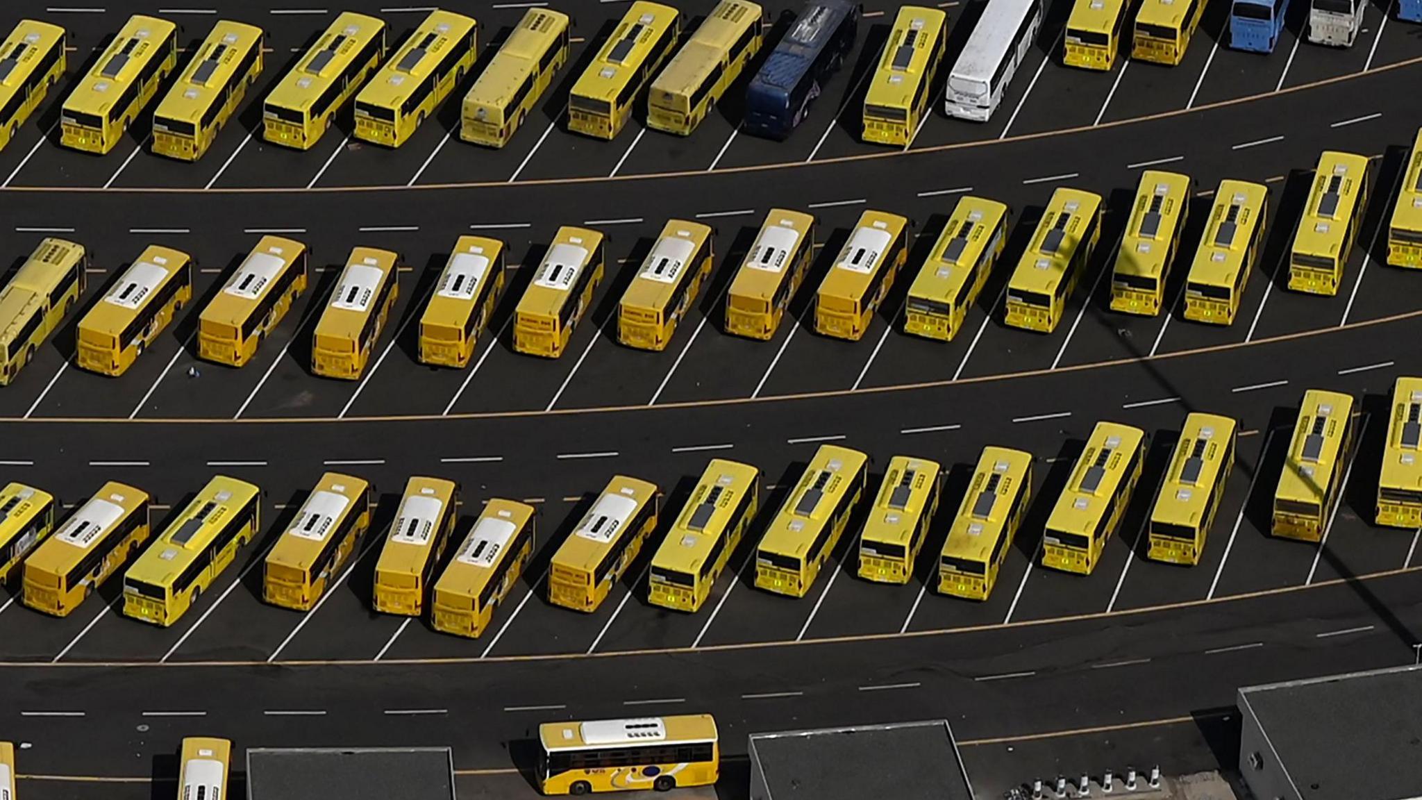 aerial view of rows of buses in Islam's holy city of Mecca on 30 June 2023 during the hajj pilgrimage