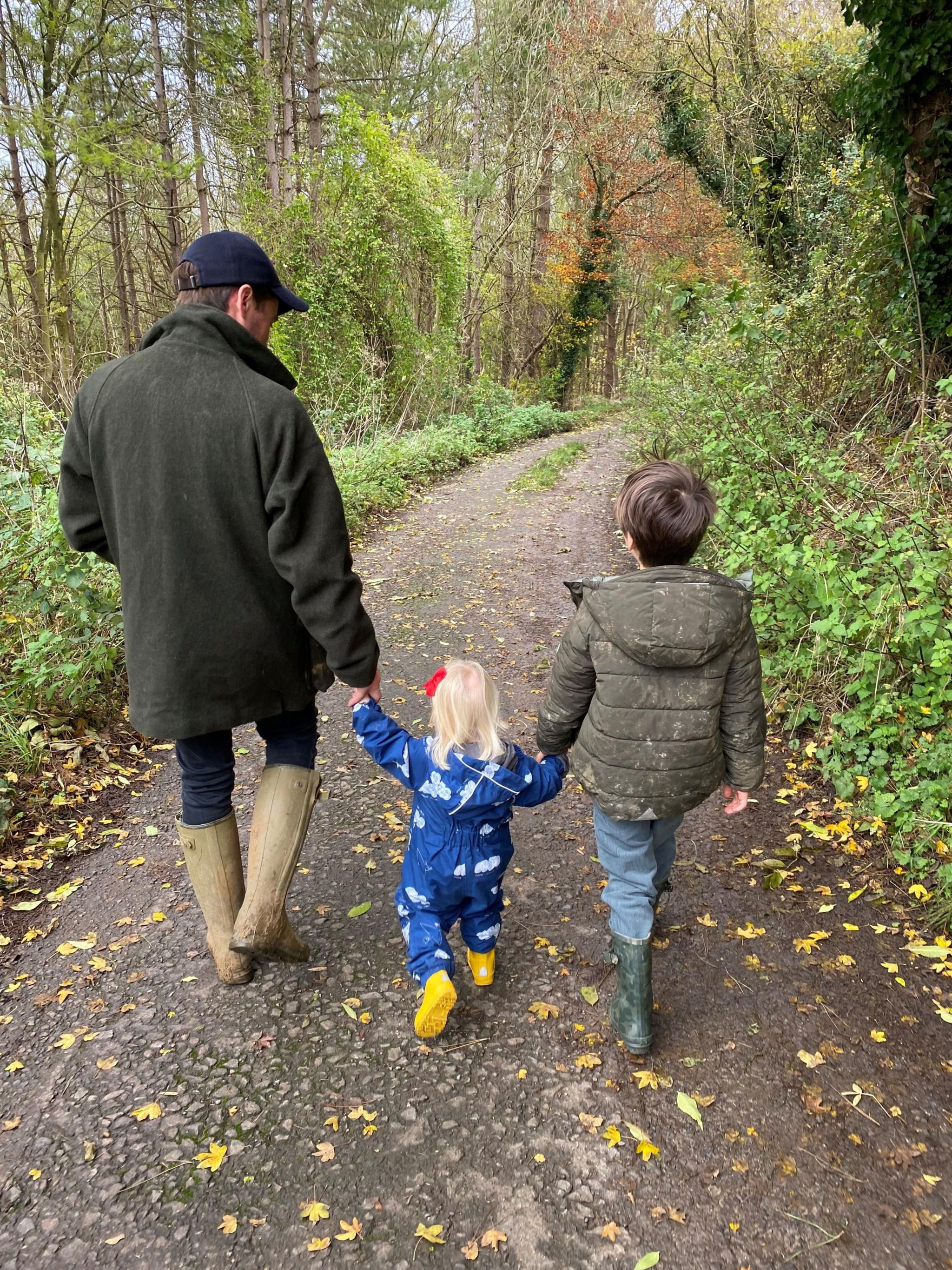 Picture of Mr Mapelli Mozzi holding hands with his children