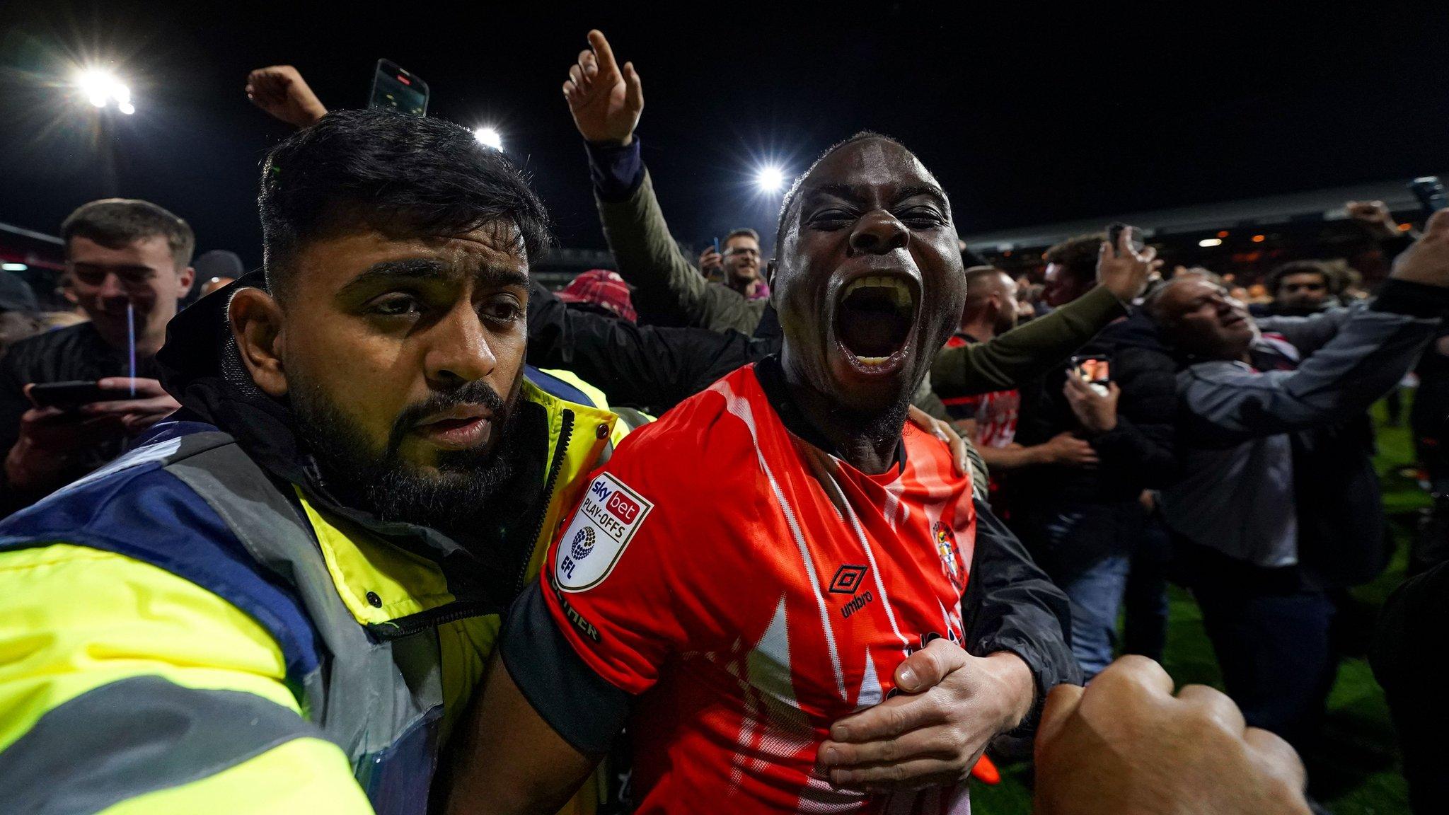 Luton's Pelly Ruddock Mpanzu celebrates his side reaching the Championship play-off final