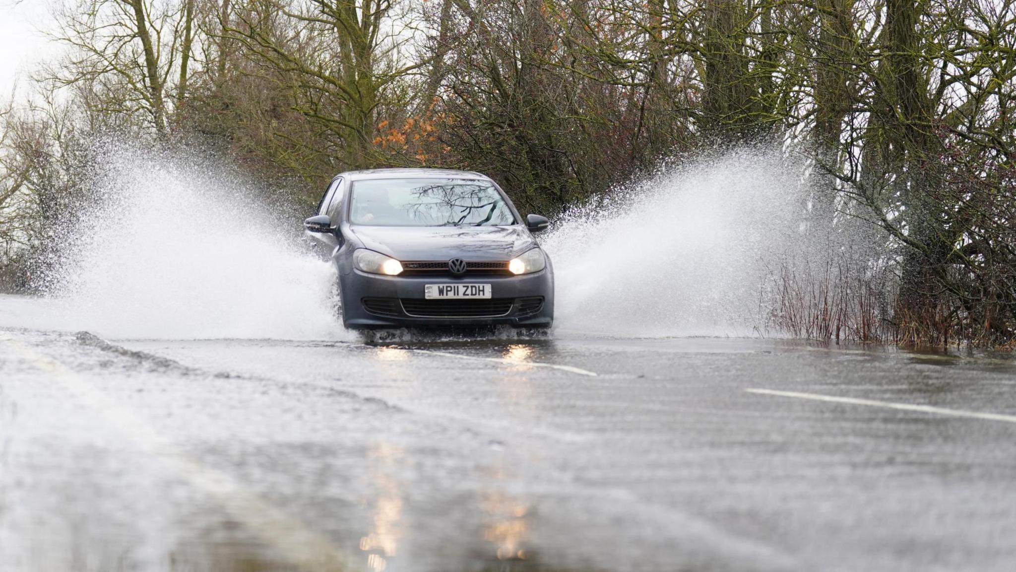 Car driving through floods