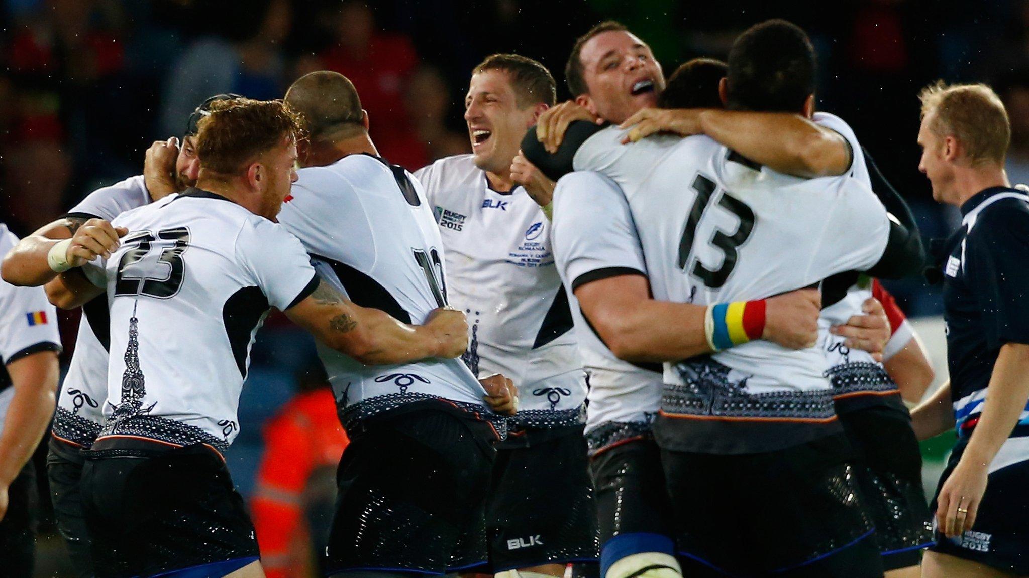 Romania players celebrate victory