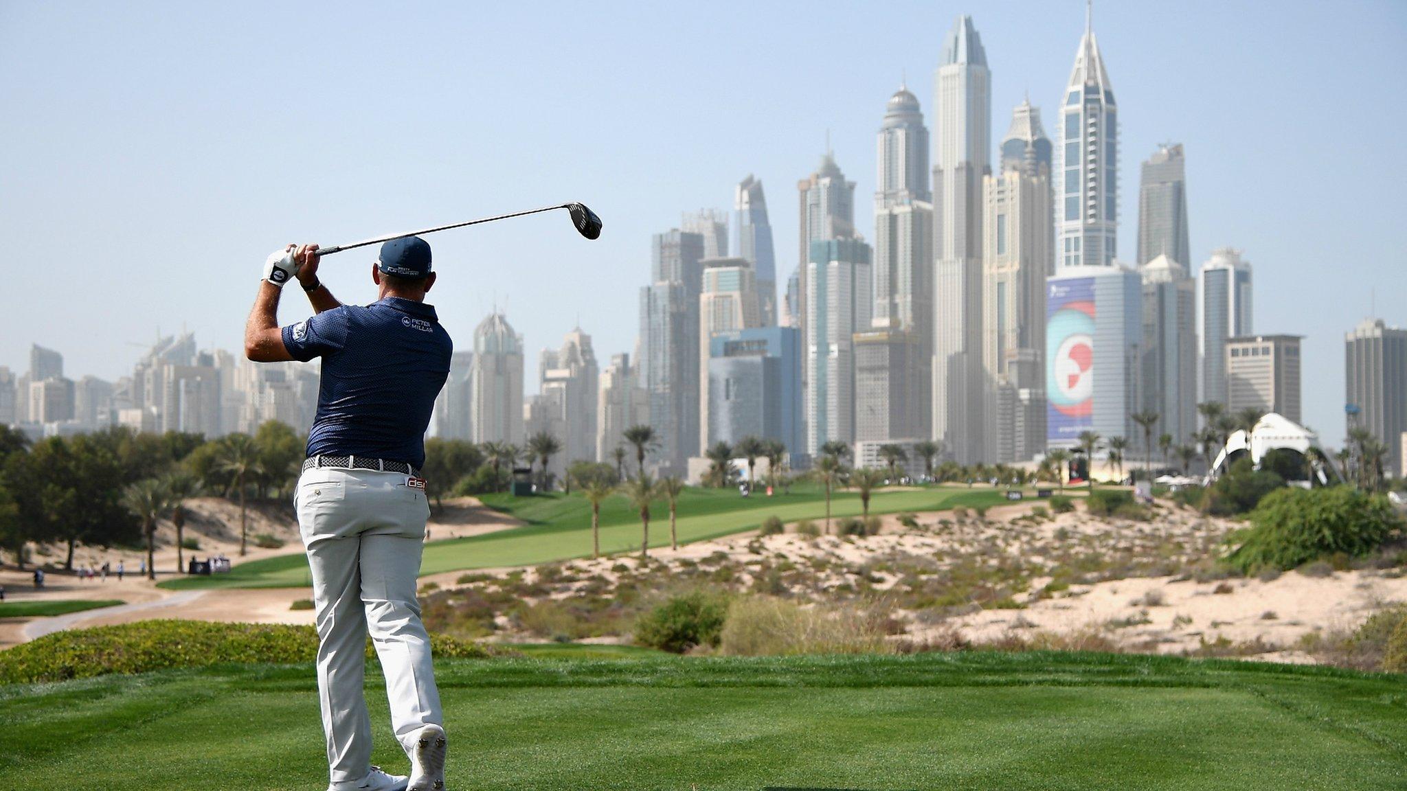 Dubai, United Arab Emirates, 26 January: The Dubai skyline towers over England's Lee Westwood as he takes his tee shot during day three of the Omega Dubai Desert Classic at Emirates Golf Club. Westwood finished eighth at the European Tour event, nine shots behind United States' winner Bryson DeChambeau. (Photo by Ross Kinnaird/Getty Images)