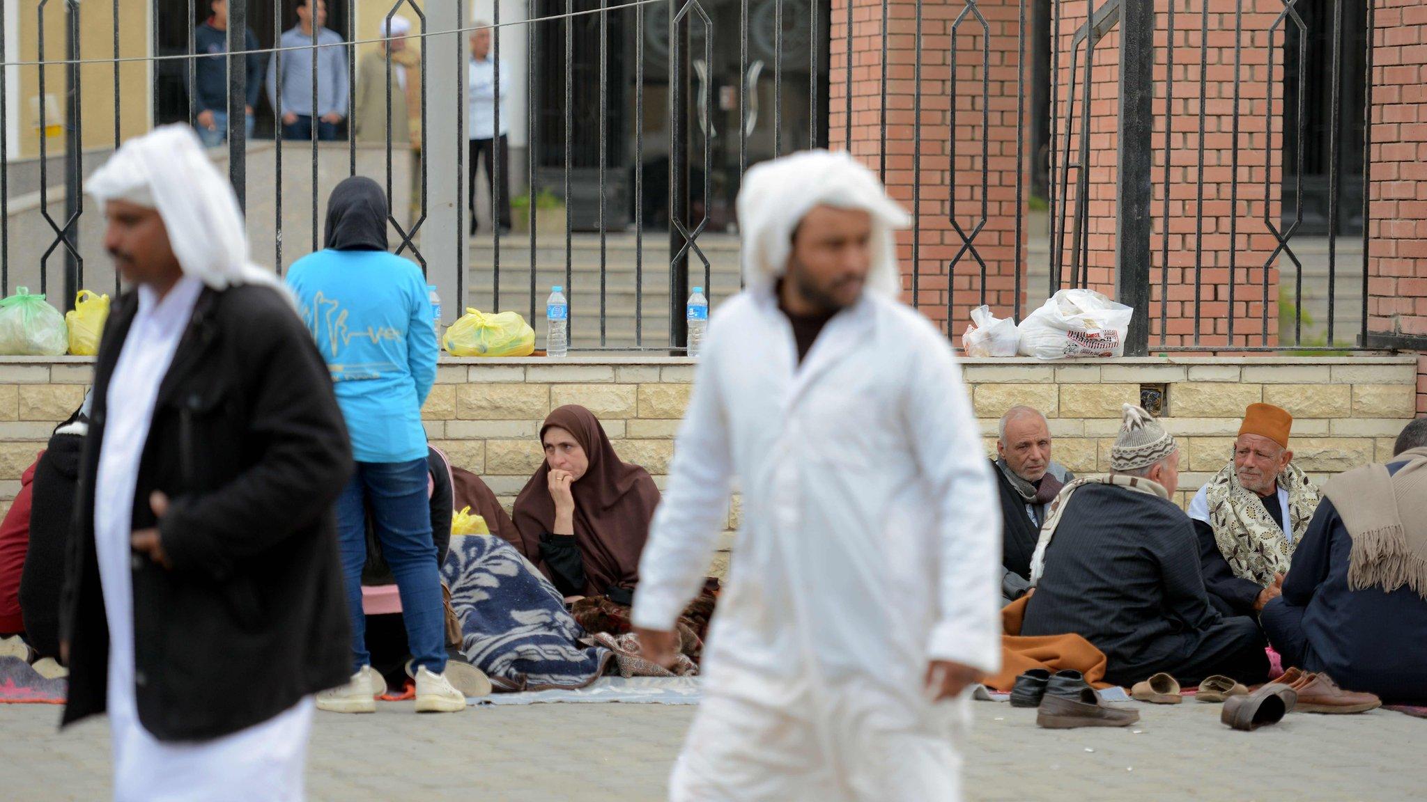 Relatives of the victims of the bomb and gun assault on the North Sinai Rawda mosque wait outside the Suez Canal University hospital in the eastern port city of Ismailia on November 25, 2017