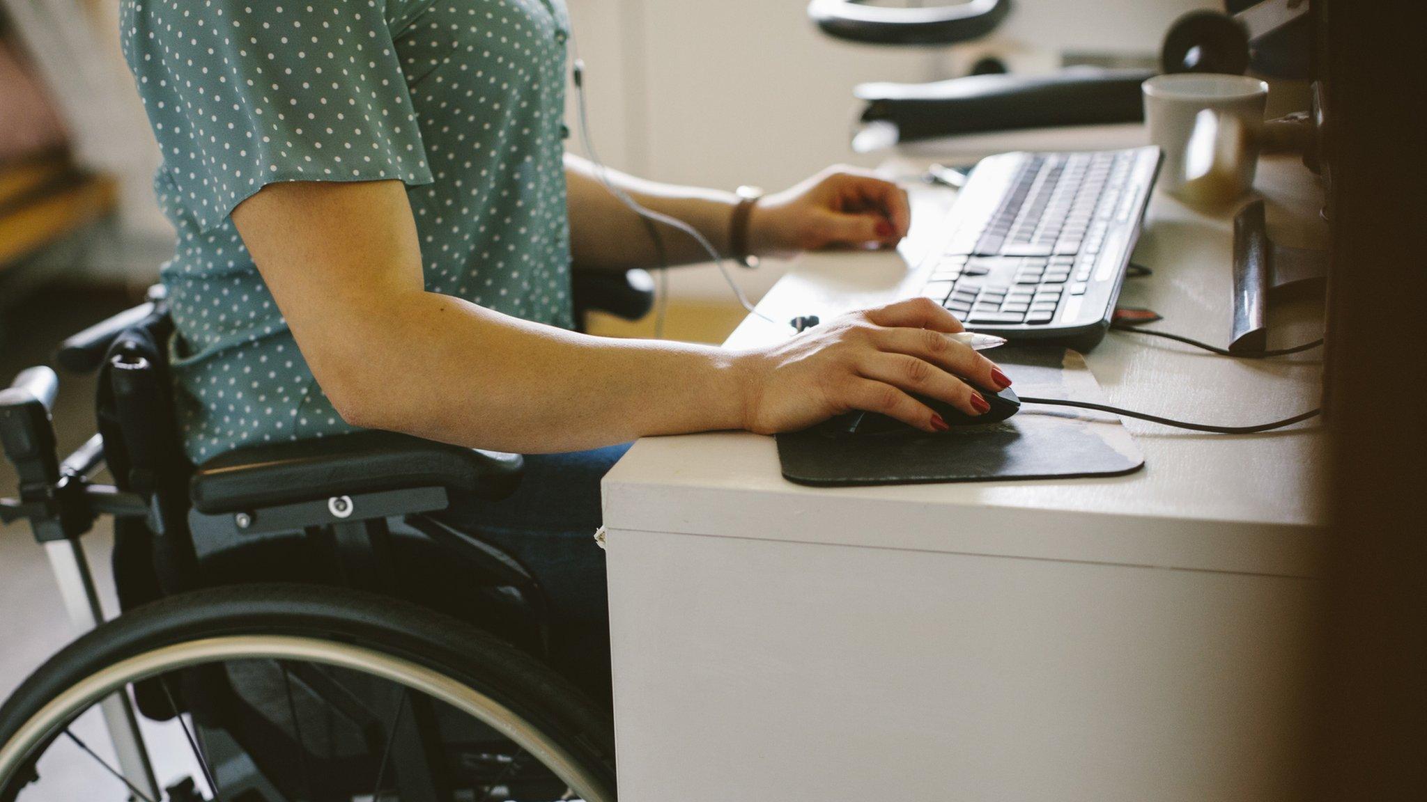 Wheelchair user at a desk