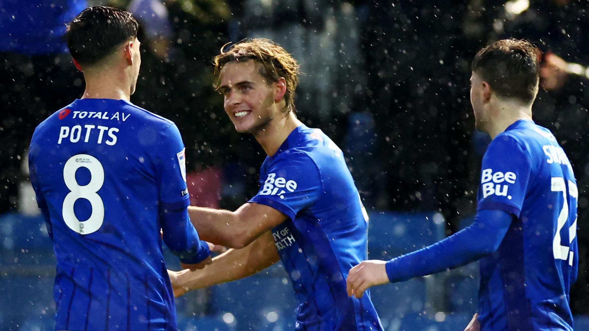 Ryley Towler celebrates scoring for Portsmouth against Swansea