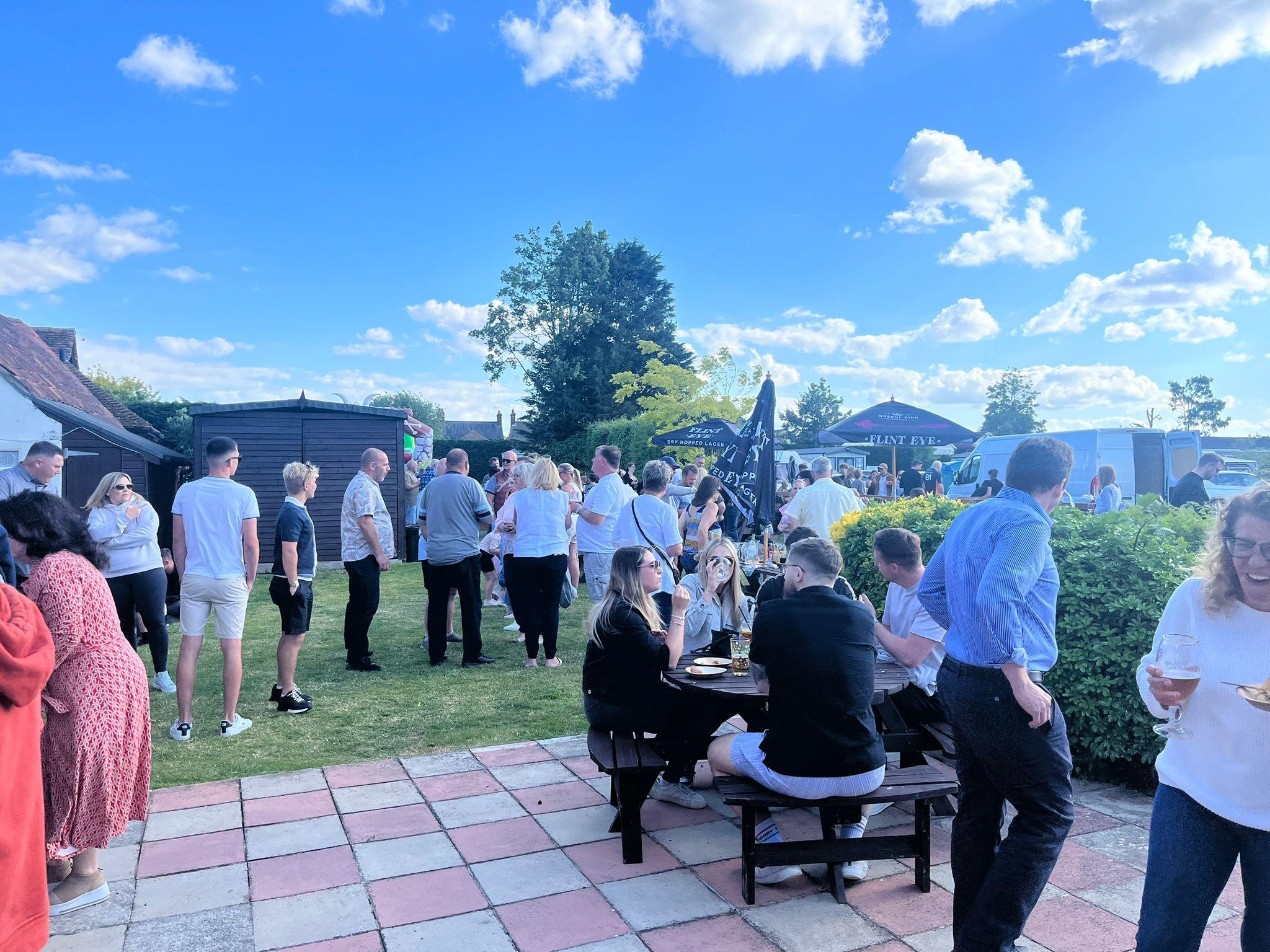 A queue of customers in the beer garden