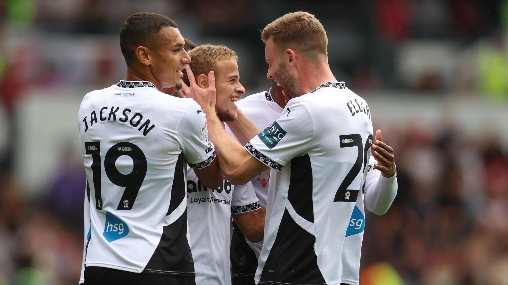 Derby County players celebrate a goal