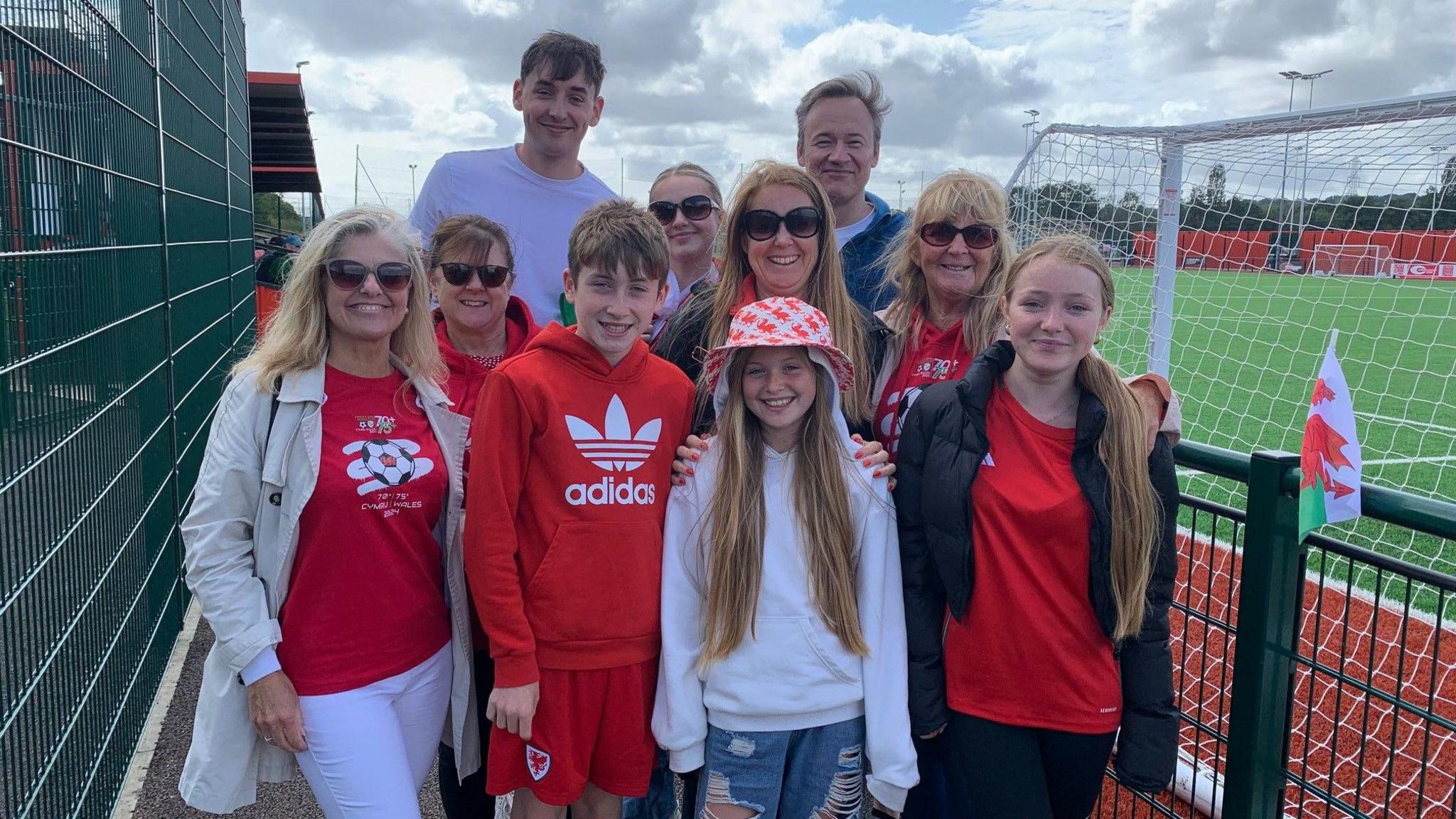 family of Wales player Steve Davies pose behind the goals