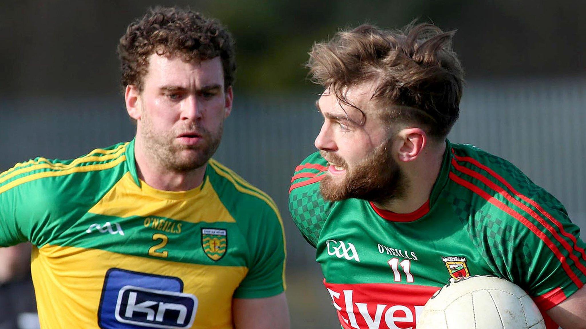 Donegal's Eamon McGee battles with Mayo's Aidan O'Shea