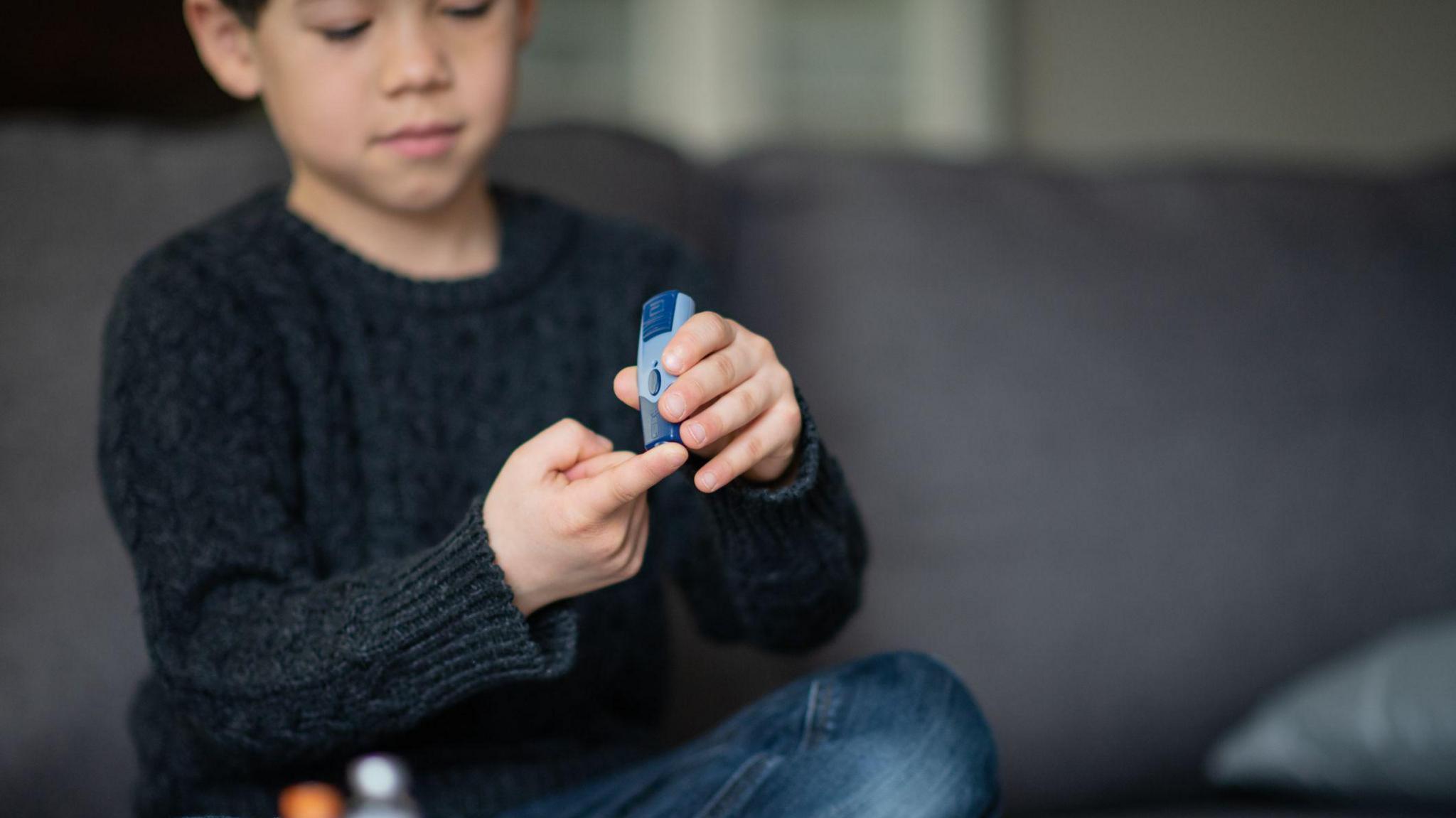 boy-checking-sugar-levels. 