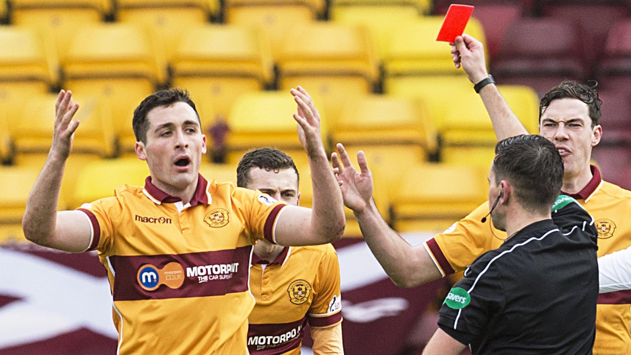 Referee Andrew Dallas shows Carl McHugh a red card at Fir Park