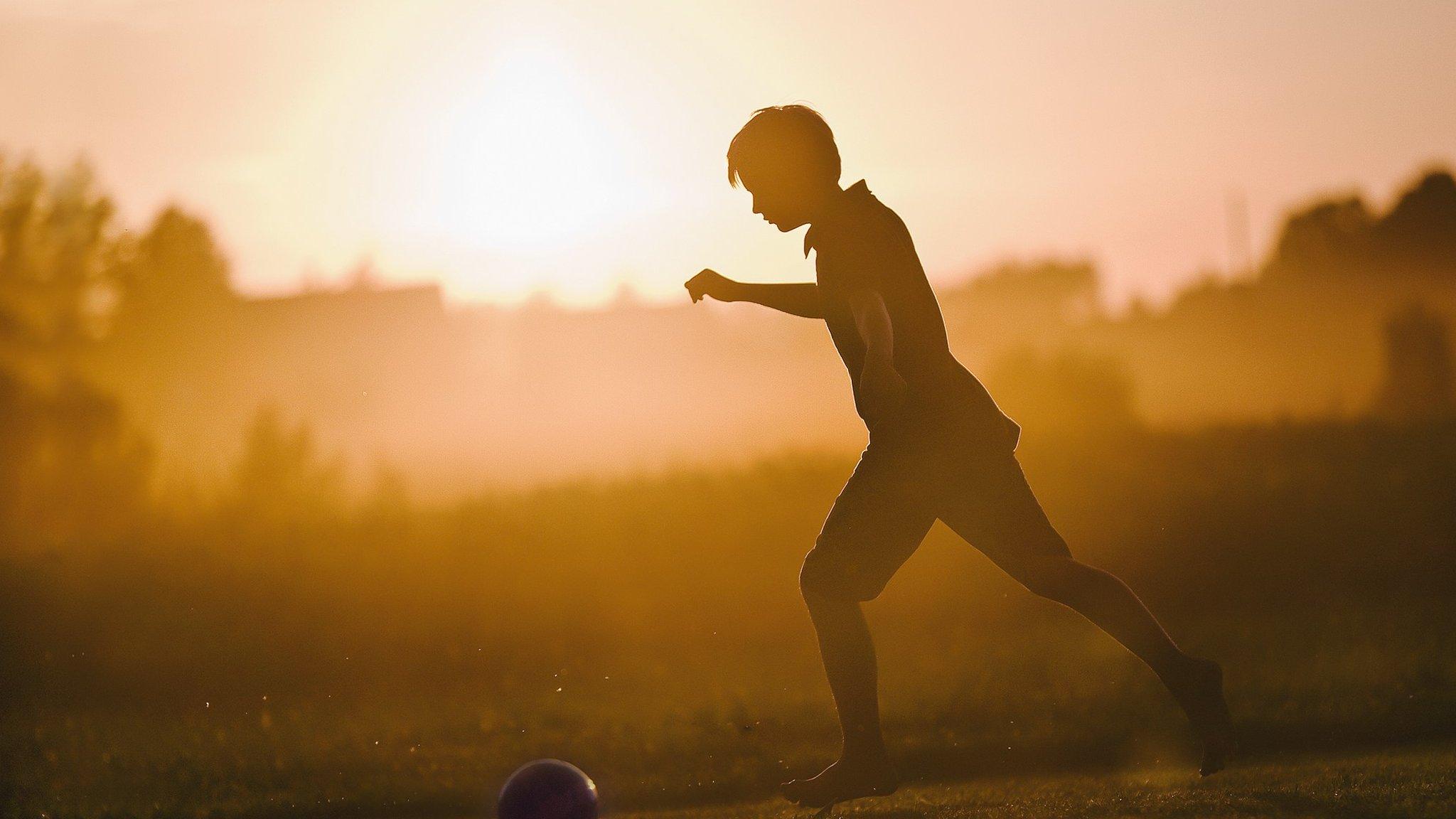 Boy playing football