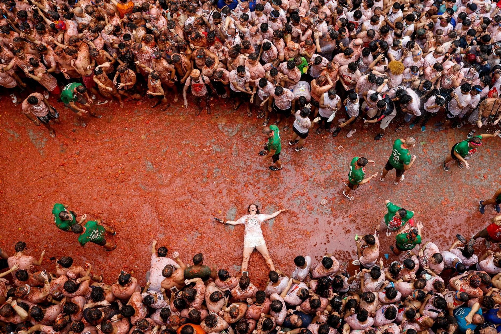 A participant lies in tomato pulp 