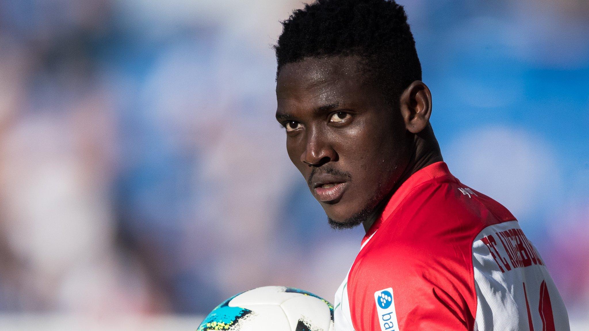 Daniel Opare prepares to take a throw-in for FB Augsburg