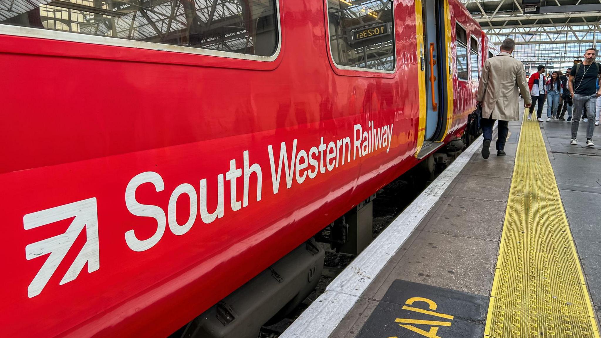A red train of South Western Railway staying in London Waterloo Station.