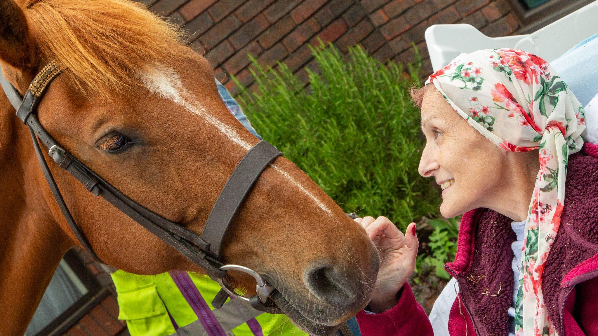 Hayley Golding with a horse outside a hospice in Aylesbury