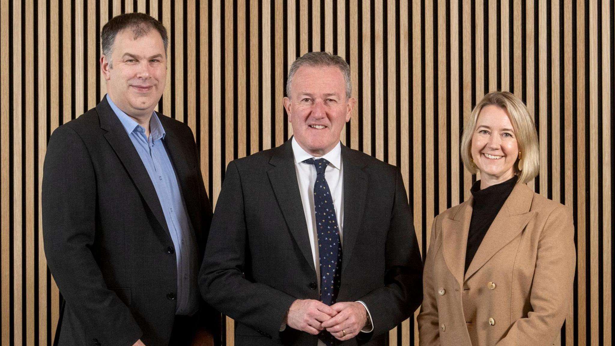 Economy Minister Conor Murphy is pictured with Brendan McGuigan, Director of Advanced Manufacturing and Engineering at Invest NI, and Caoimhe Keogan, Chief People Officer, Aveva